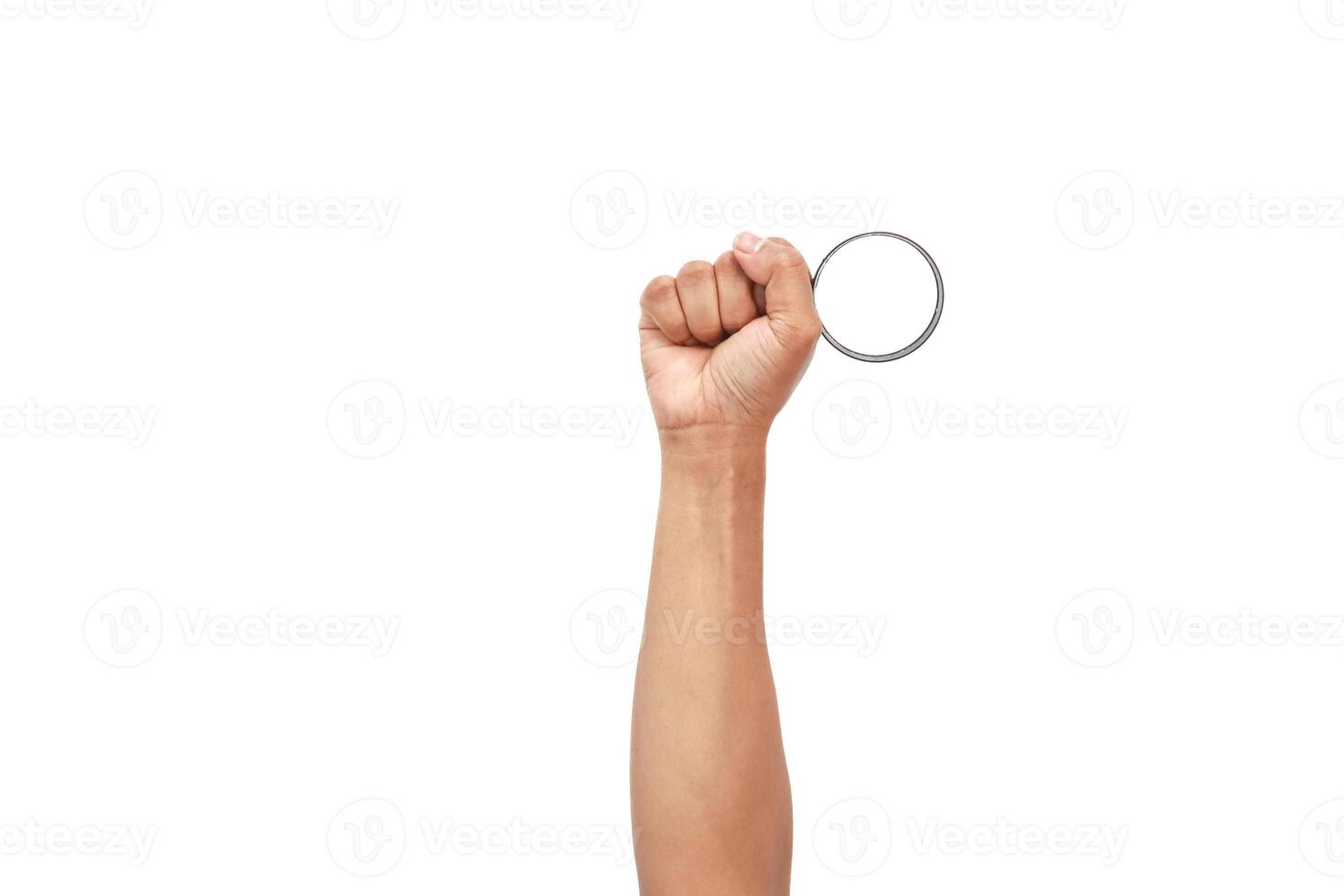 Arm raised in fist holding a circular object, isolated on white background with copy space photo