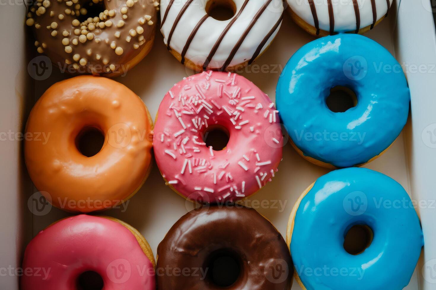 Colorful Assortment of Donuts in a Box Ready to Eat and Enjoy Delicious Sweet Treats photo