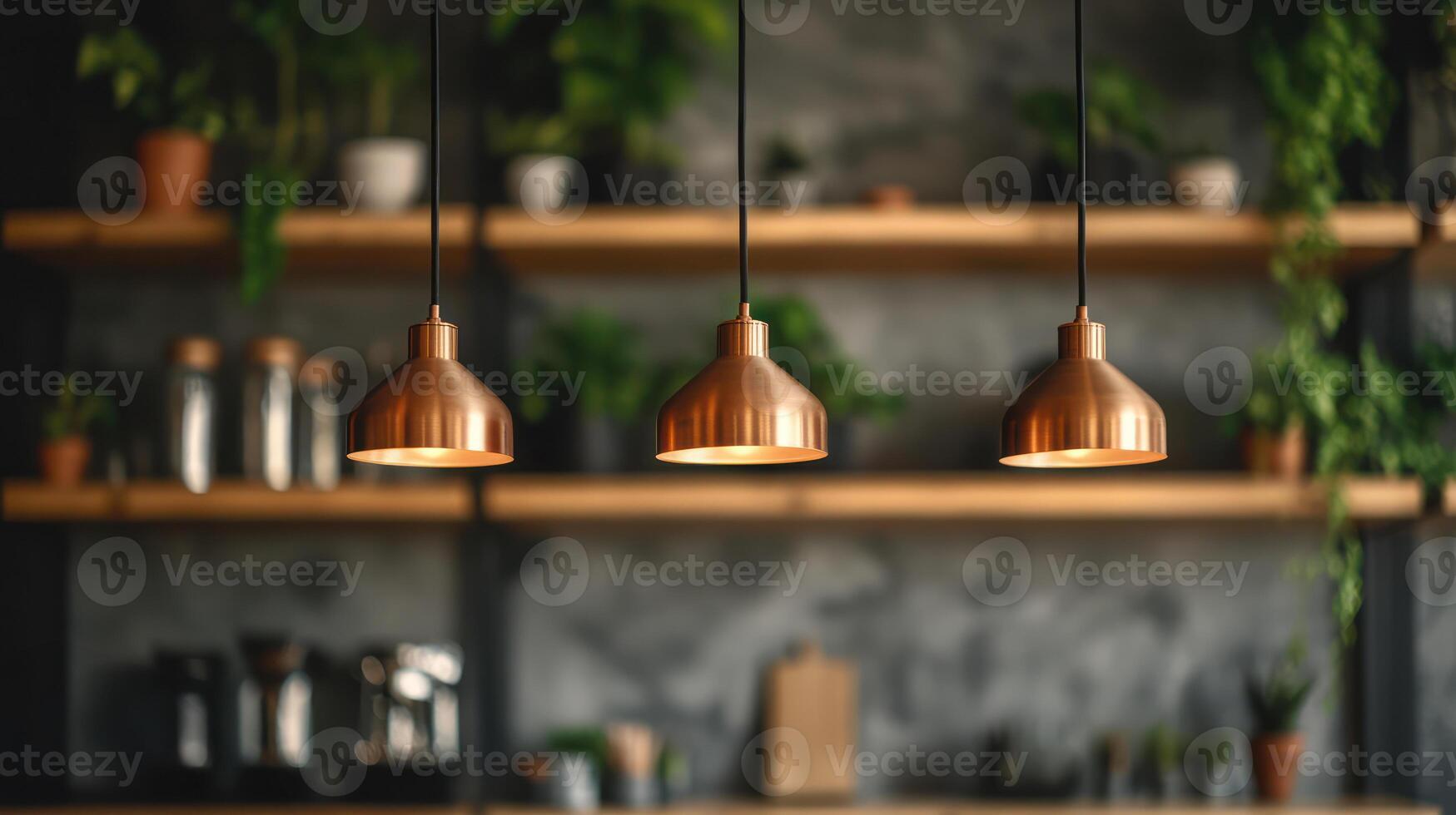 Copper pendant lights hanging in front of blurred kitchen shelves with plants and jars. Warm lighting in modern rustic interior. Kitchen lighting and decor concept. photo