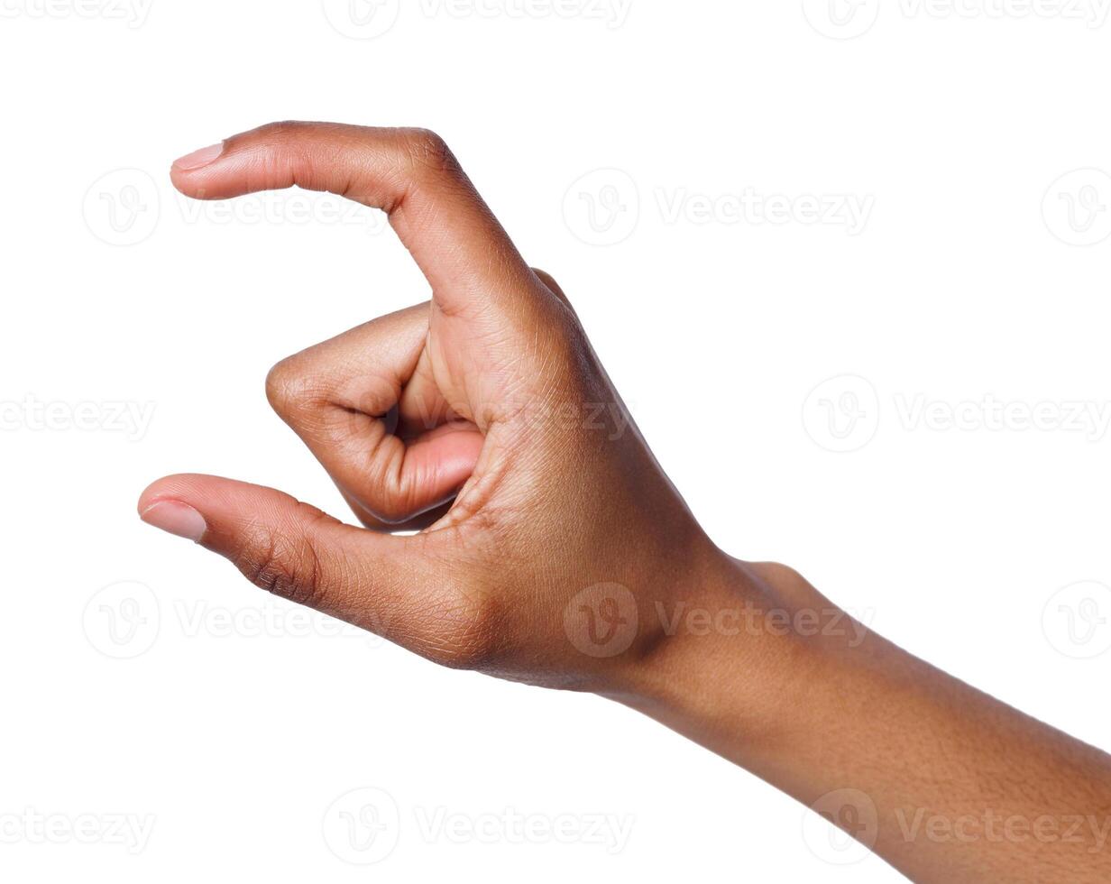 Black female hand measuring invisible items, woman's palm making gesture while showing small amount of something on white isolated background photo