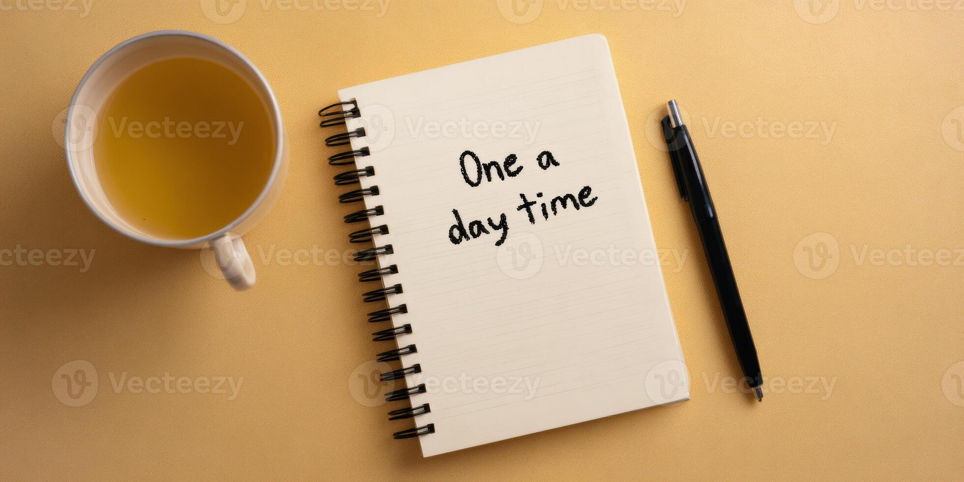Motivational notebook with daily reminder and tea for productivity inspiration photo