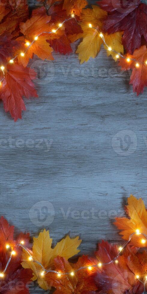 Autumn still life with fallen leaves and glowing lights for seasonal decoration photo