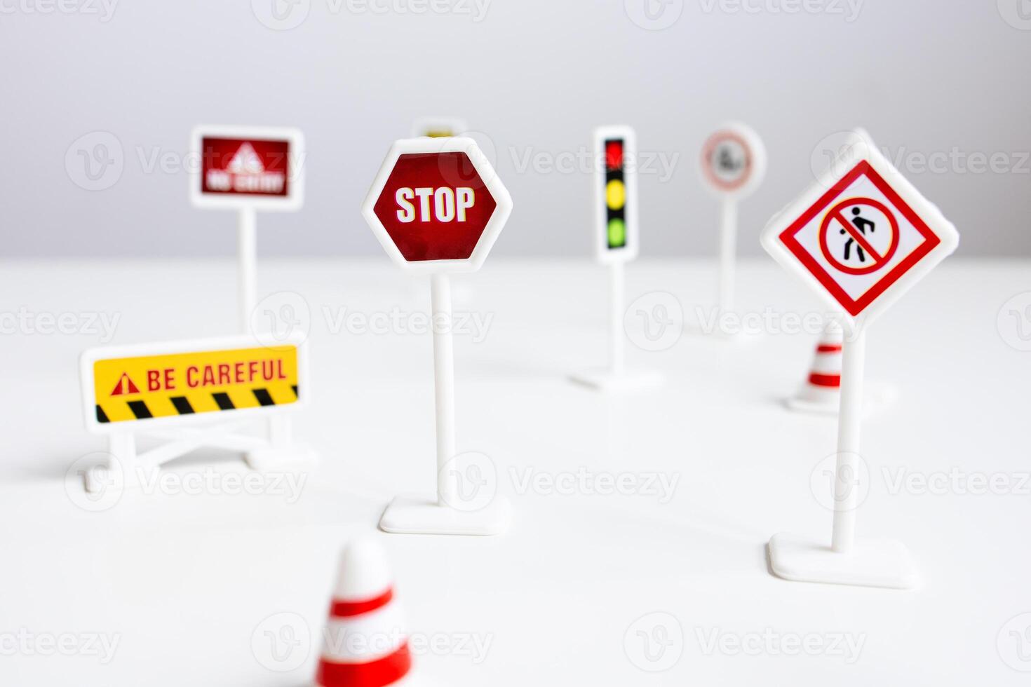 Miniature road signs collection on white background for traffic education photo