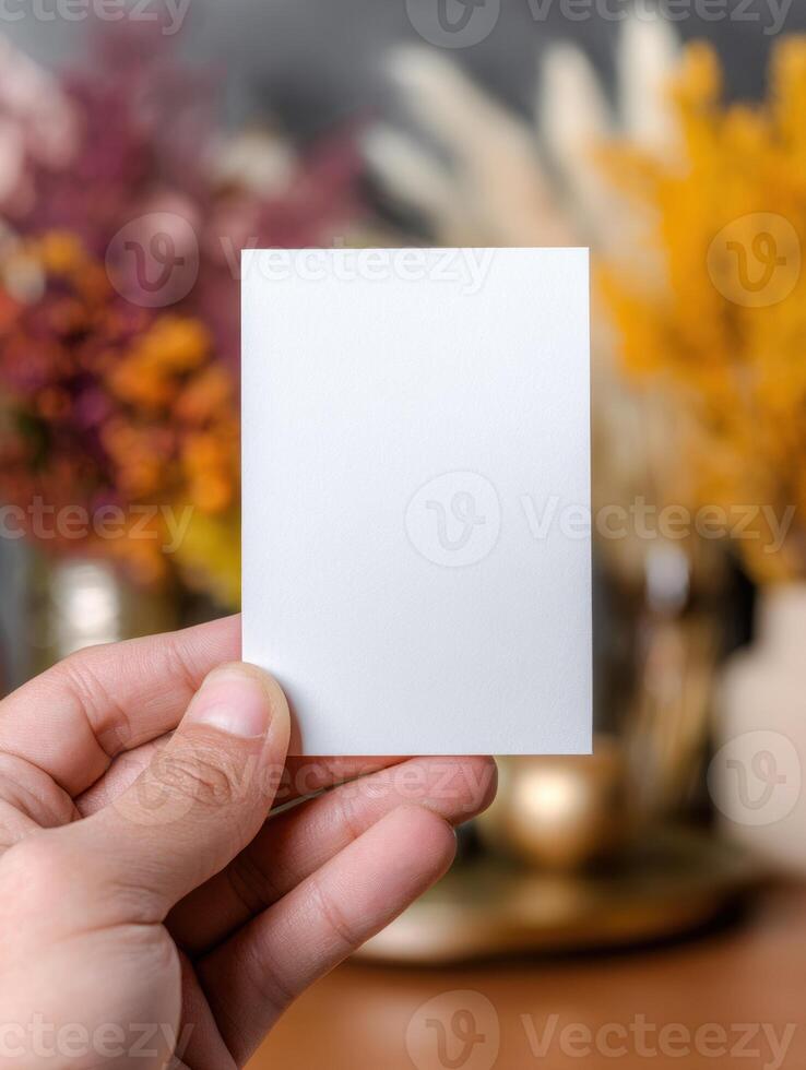 Minimalist vertical business card mockup held by hand for professional design concepts photo