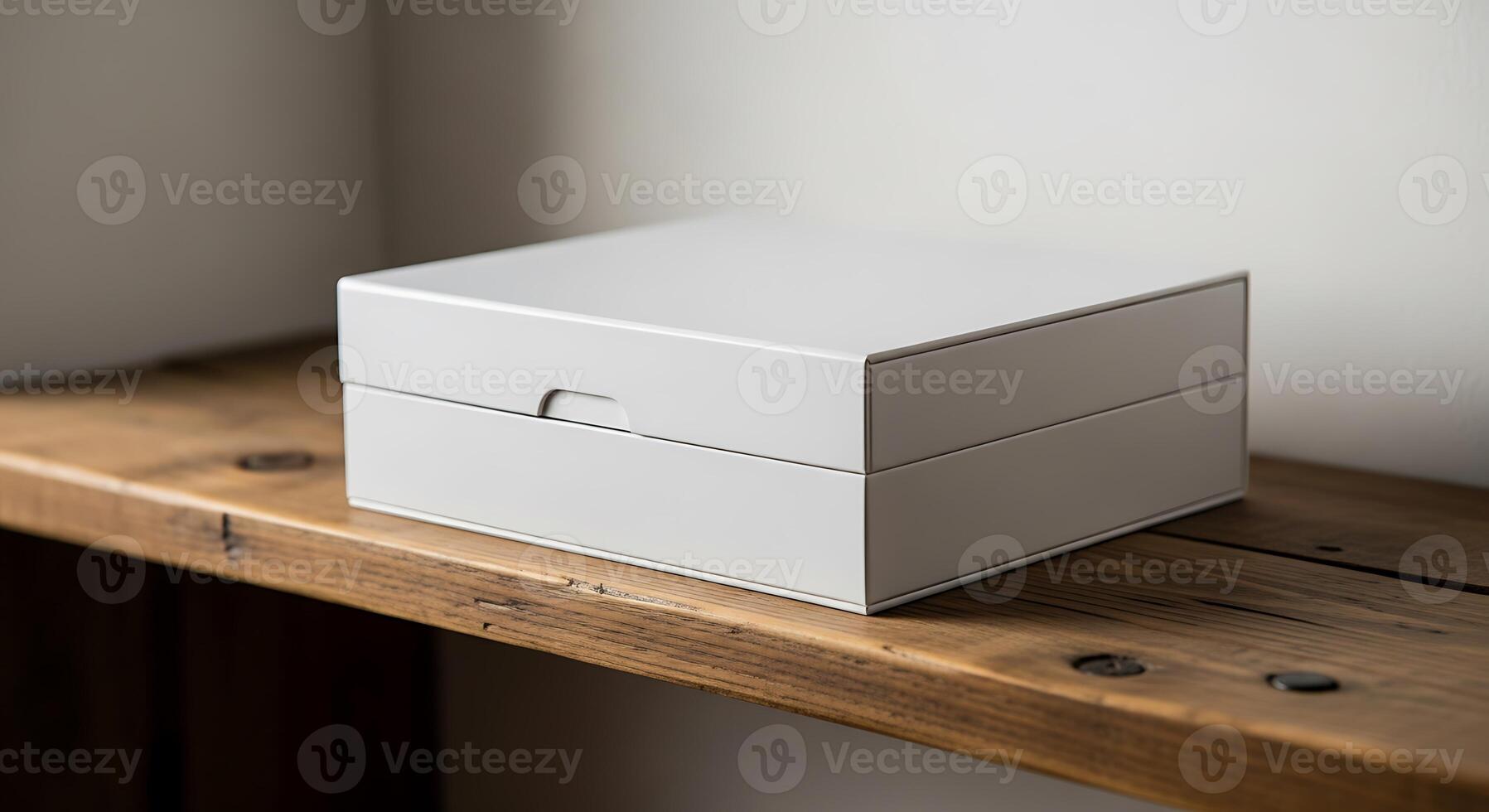 A gray box sits on a wooden shelf against a plain wall in a simple and minimalist setting indoors photo