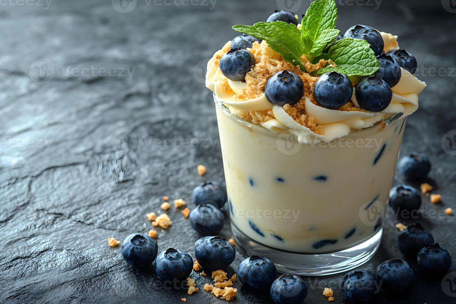 Blueberry Parfait Dessert with Cream, Mint, and Crumb Topping on Dark Background for Food Photography photo