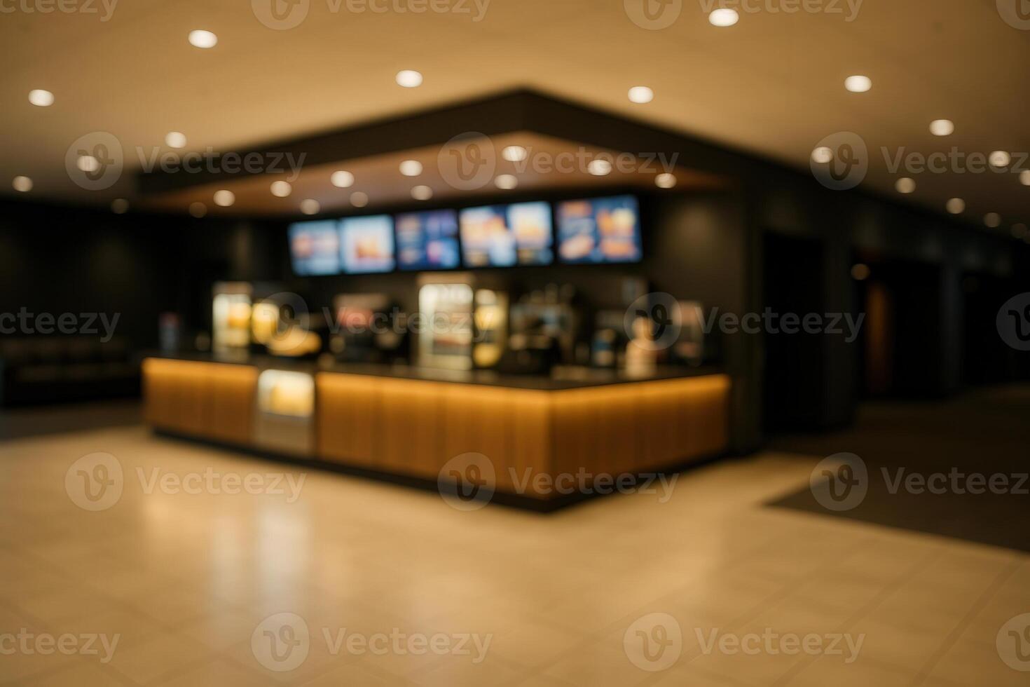 Blurred View of Cinematic Concession Stand with Illuminated Menu Displays and Warm Lighting in Modern Theater photo