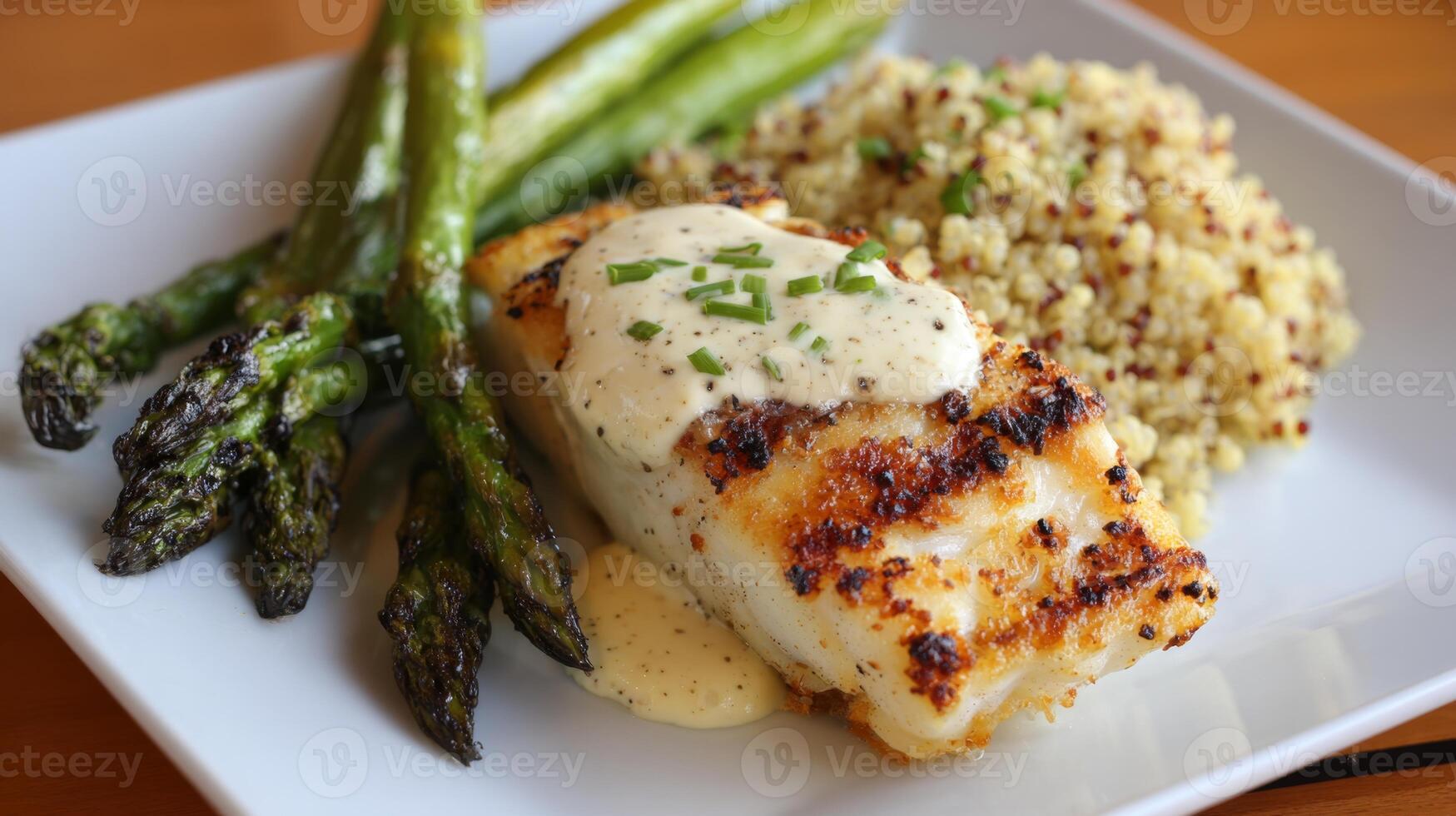 A well-prepared diabetic menu features grilled cod topped with sauce, alongside fluffy quinoa and vibrant grilled asparagus spears served on a clean white plate. photo
