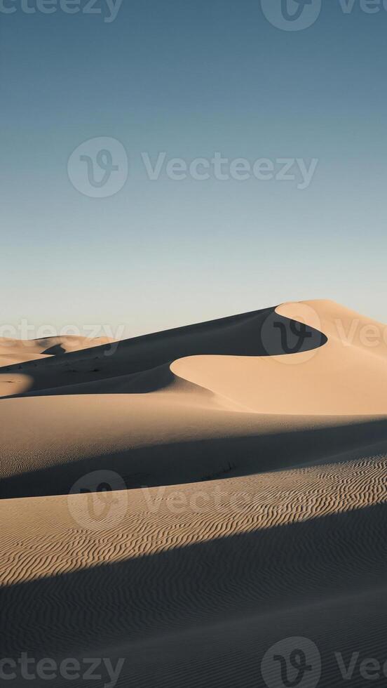 Golden Desert Dunes Abstract S-Curve, Deep Shadows, and Wavy Ripples under Clear Sky photo