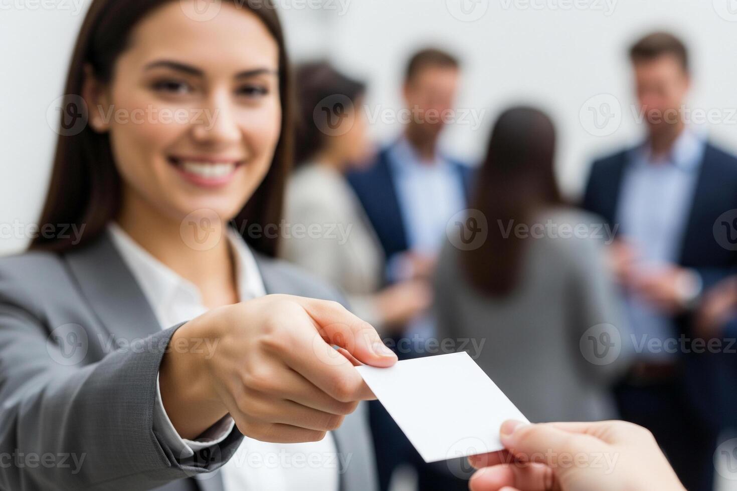 Focused Connection Professional Woman Exchanges a Blank Business Card with a Smile photo