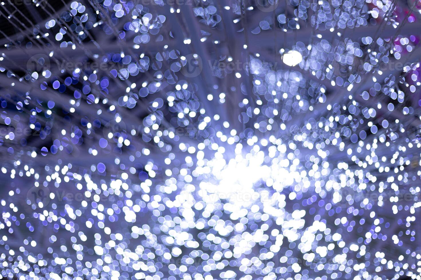 bokeh abstract blue circle star bokeh lights festival with black background photo