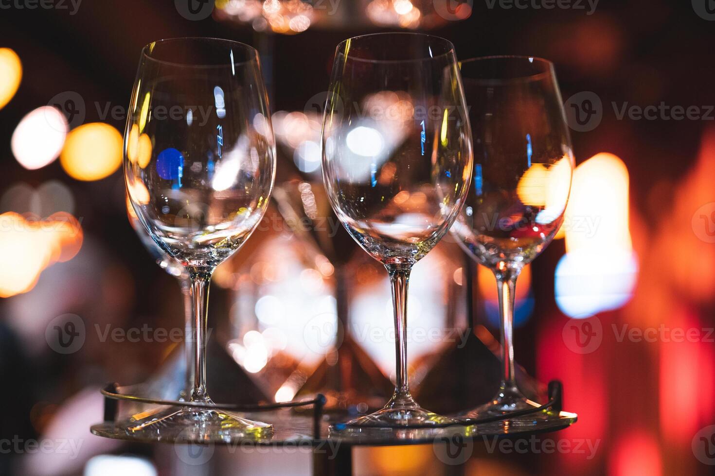 .empty clean glass glasses for alcoholic drinks in a restaurant on a bar counter photo