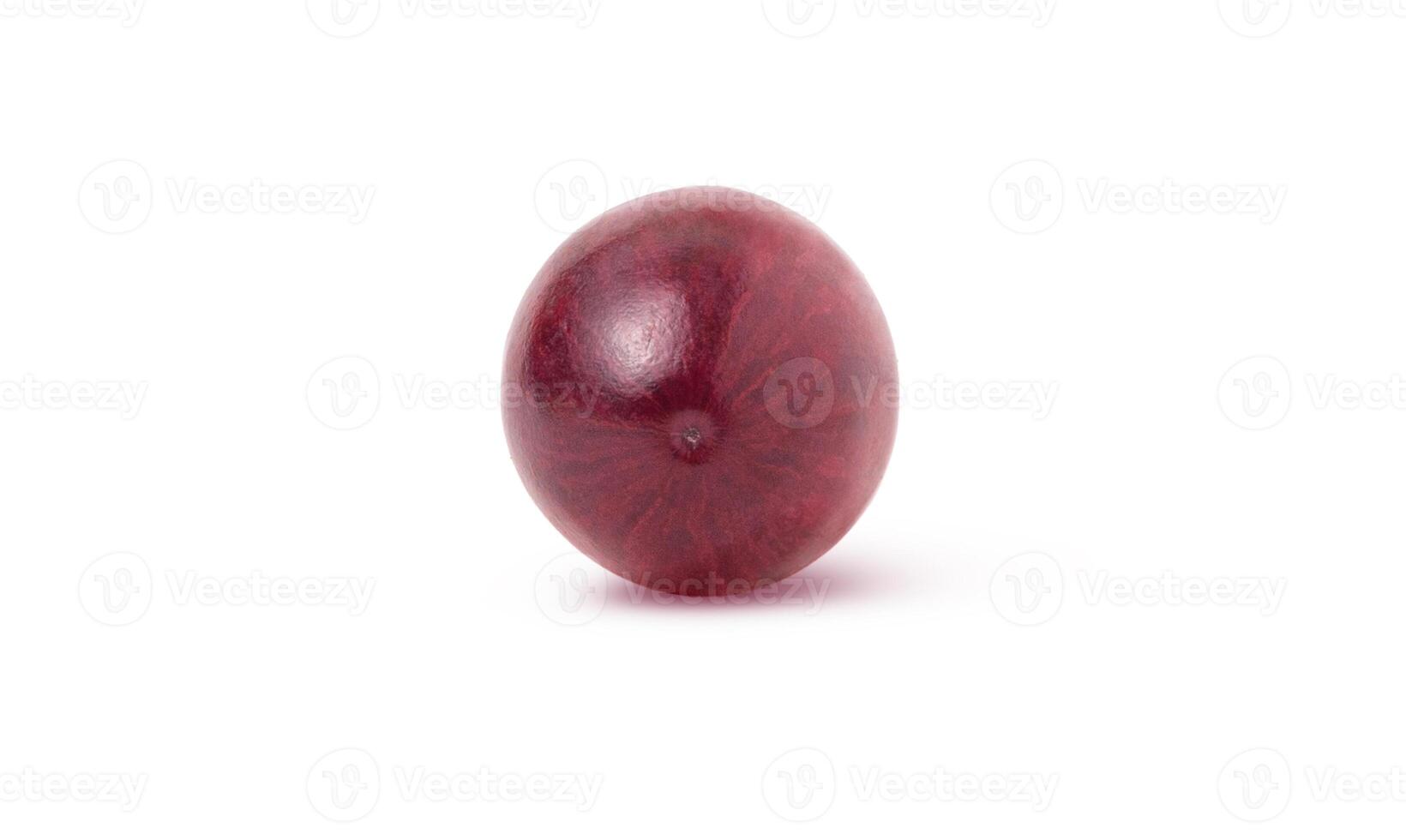 Single red wine grape isolated on white background with shadow photo