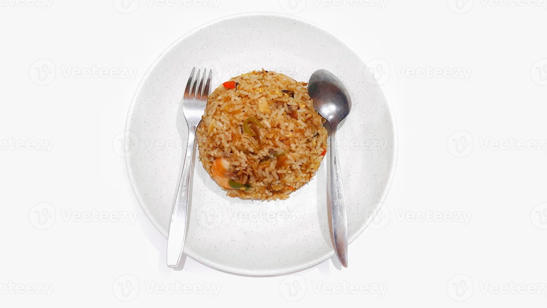 Prawn fried rice served on white plate spoon and fork isolated on white background photo
