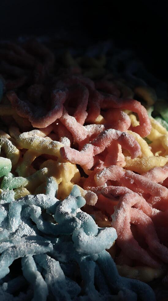 Colorful Sweet Treats Sprinkled with Sugar in Dramatic Light. photo