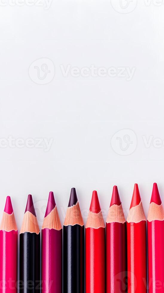 Ten Sharpened Colored Pencils in Shades of Red and Pink photo