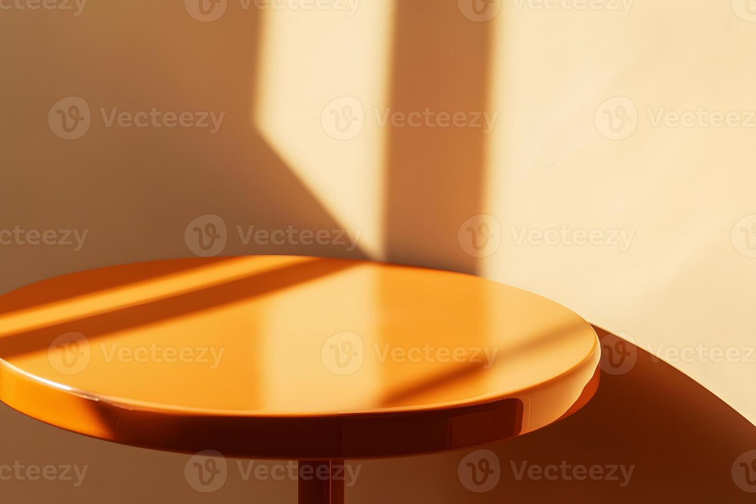 Round Orange Table with Sunlight Shadows on Yellow Wall photo