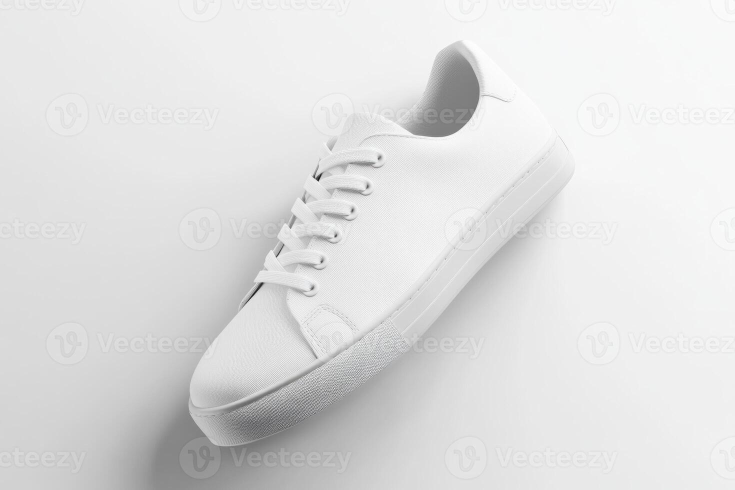 Minimalist White Sneaker Angled on White Background with Subtle Shadows photo