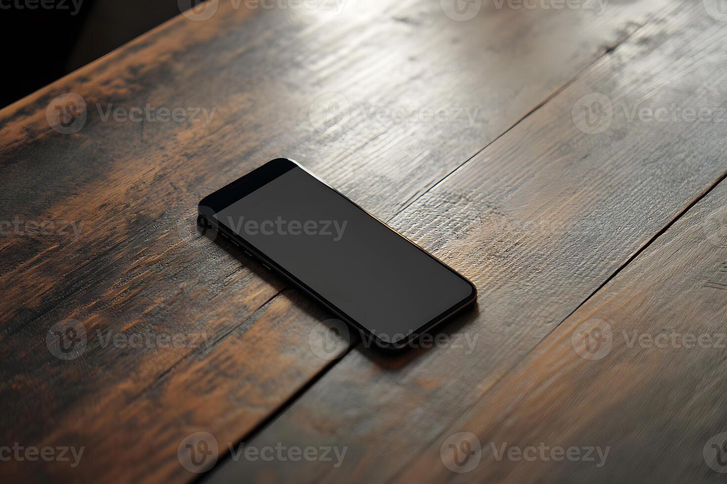 Sleek Black Smartphone Resting on a Rustic, Textured Wooden Tabl photo