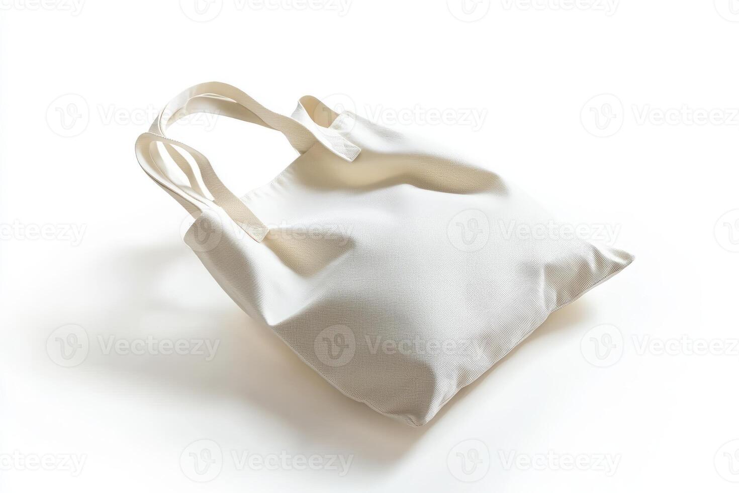 Minimalist white tote bag with textured fabric and soft shadows on a white background photo