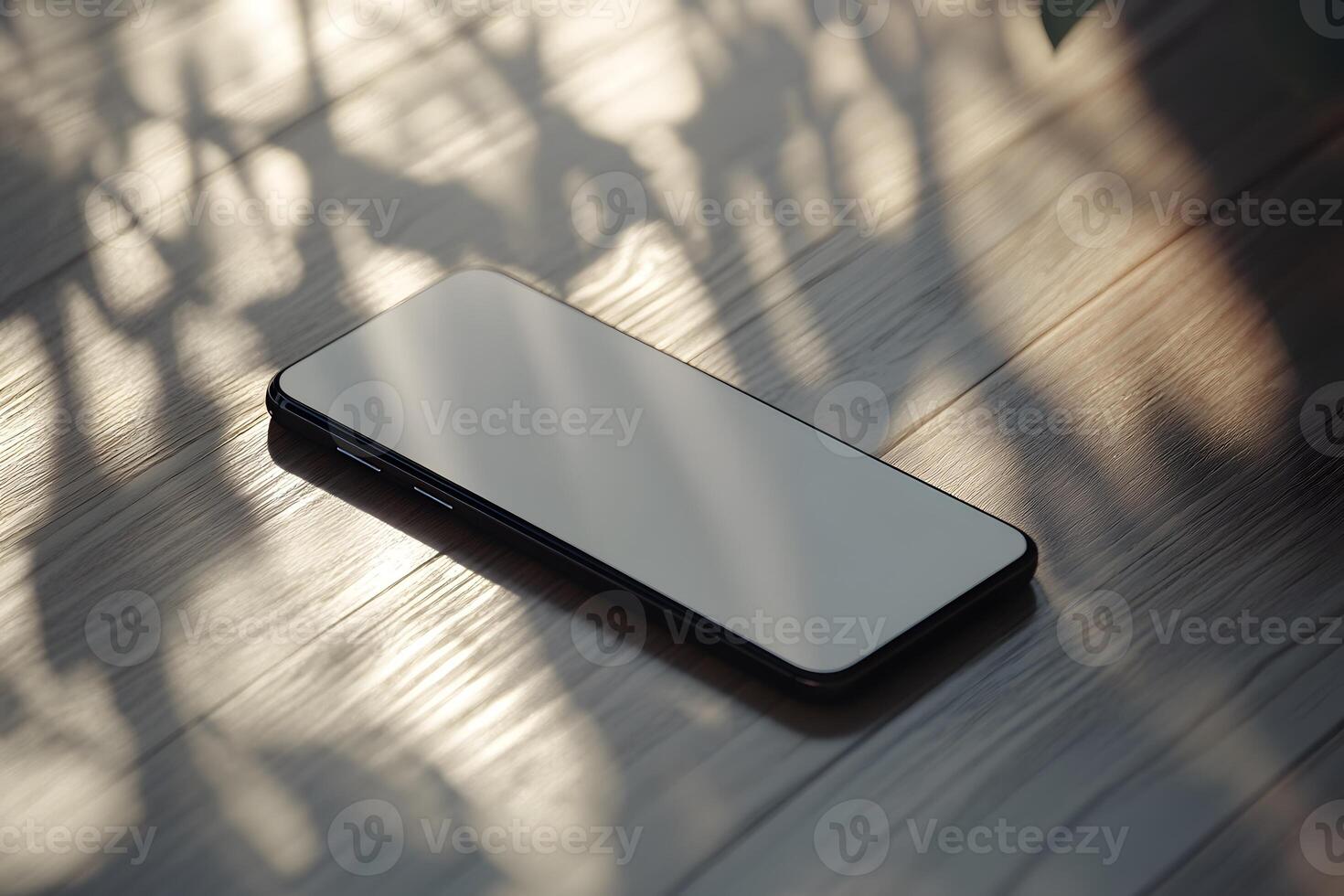 Smartphone on Wooden Surface with Dramatic Shadows and Sunlight photo