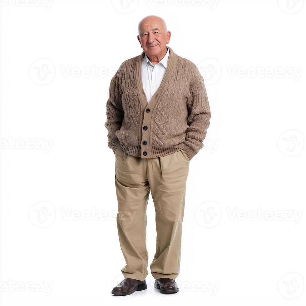 Elderly man in cardigan and khakis standing against a white background, conveying wisdom and experience photo