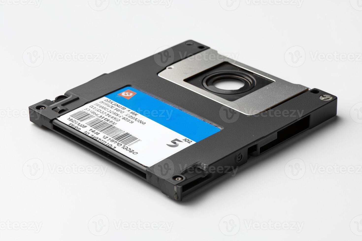 Old floppy disk with scratched label isolated on white background evokes nostalgia for early computing days photo