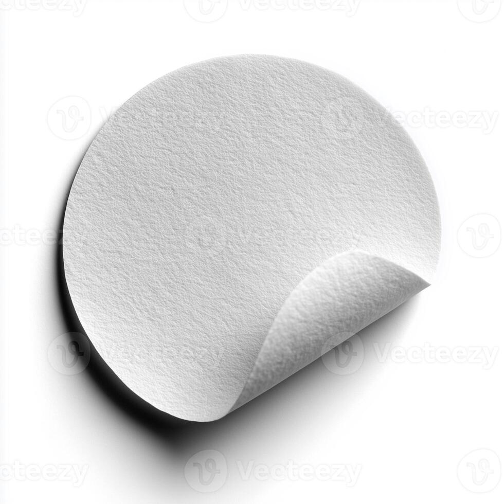 Unique white circle paper patch with a slight bend on a clean white background for creative projects photo