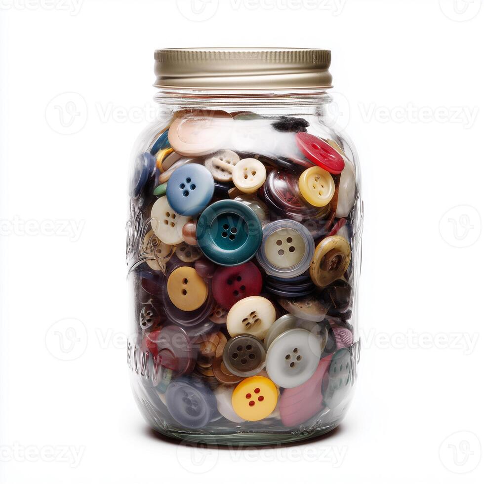 Colorful glass mason jar filled with assorted buttons on a white background for crafting and decoration photo