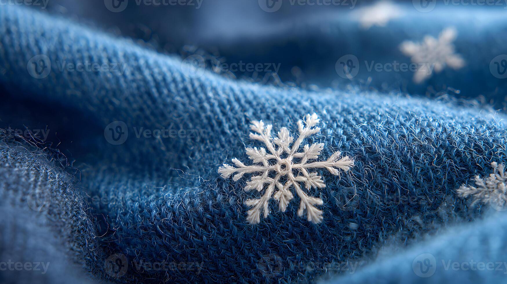 Blue knitted fabric adorned with delicate white snowflake patterns capturing the essence of winter holiday cheer and photo