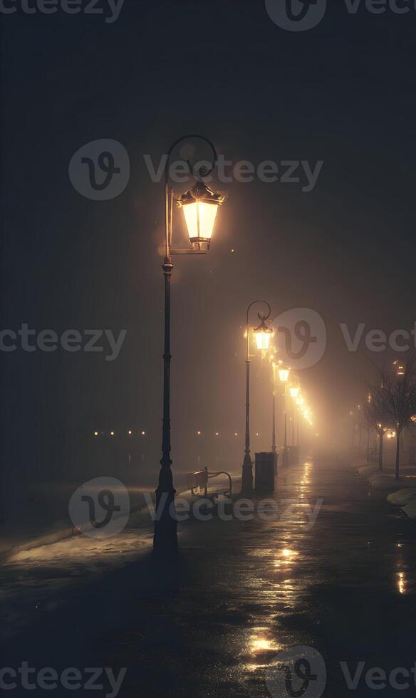 Illuminated streetlights casting a warm glow on a deserted misty seaside promenade at night creating a cinematic photo