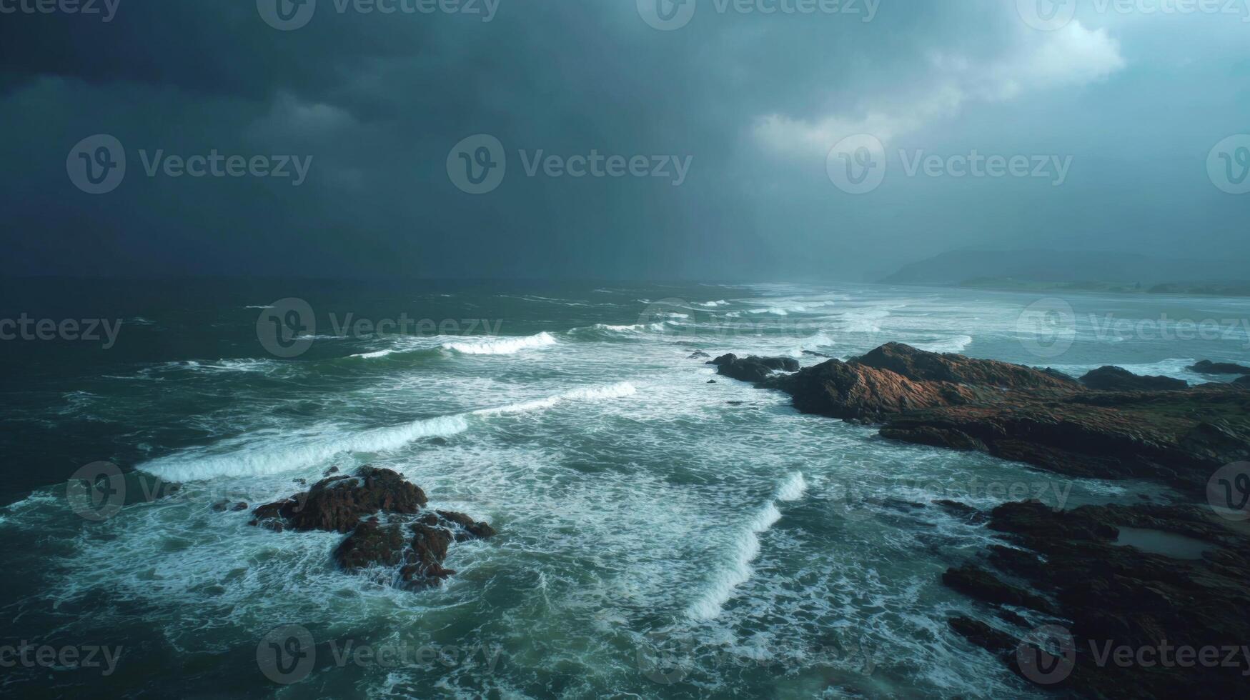 Dramatic Seascape with Dark Clouds and Turbulent Waves Crashing on Rocky Shoreline under an Ominous Sky photo
