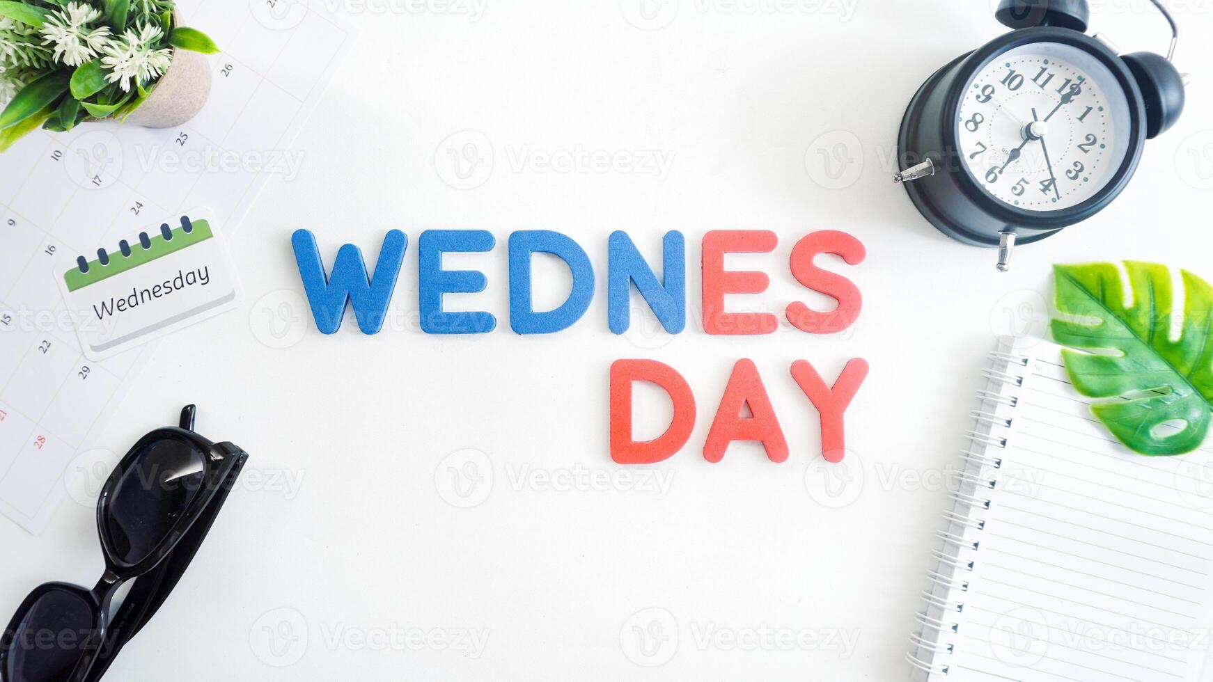 Flat lay composition with blue and red color foam letters spelling word MONDAY isolated on white background photo