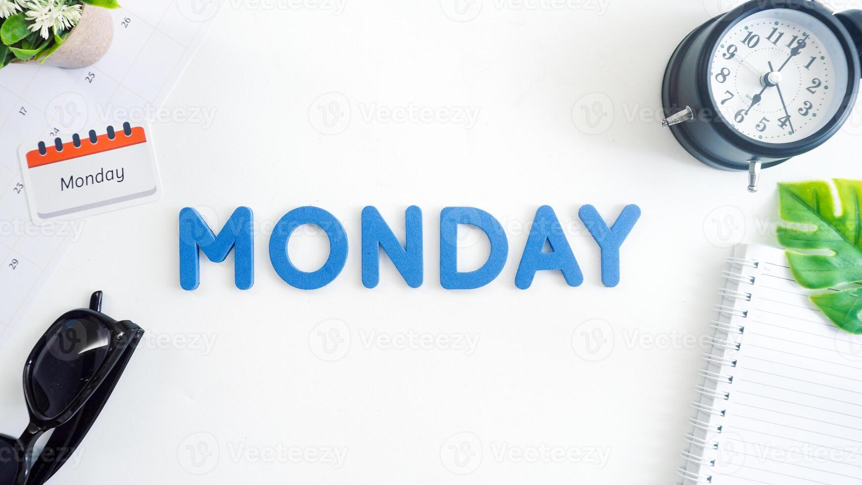 Flat lay composition with red color foam letters spelling word MONDAY isolated on white background photo