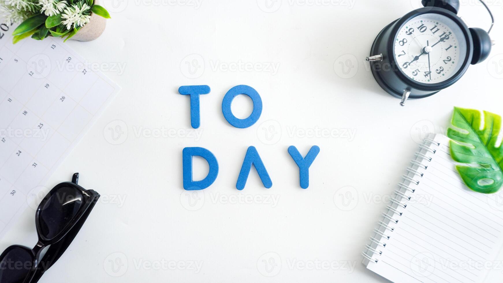 Flat lay composition with blue color foam letters spelling word TODAY isolated on white background photo