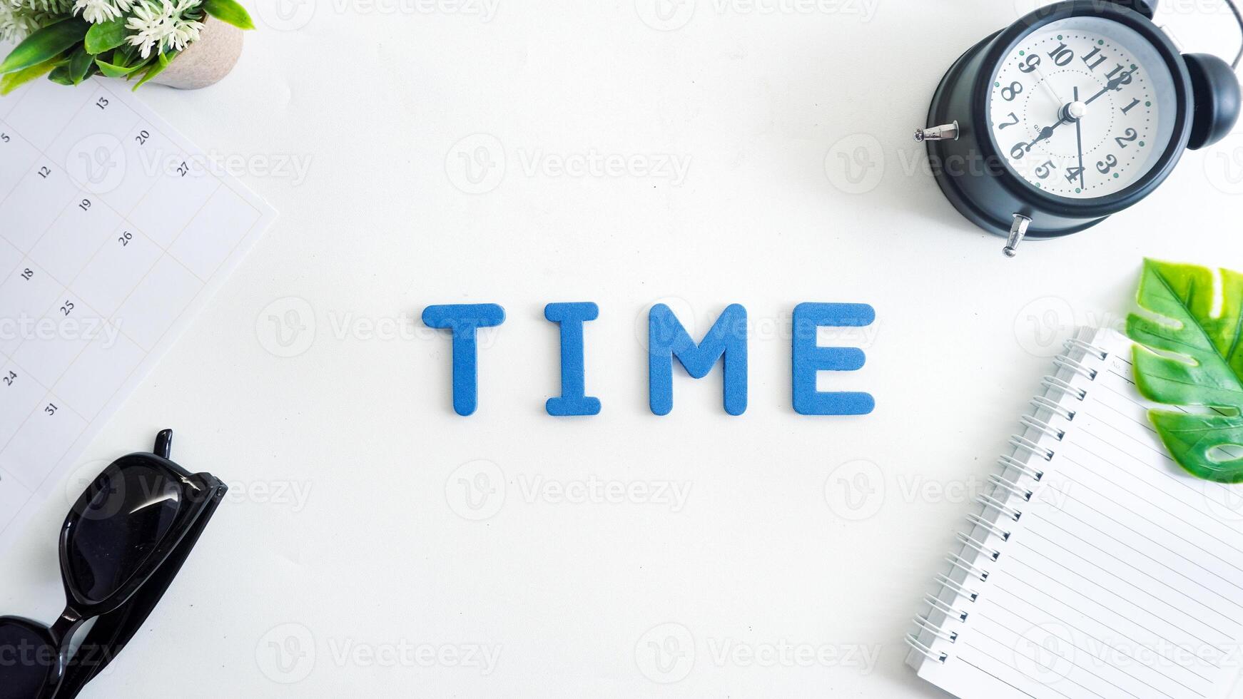 Flat lay composition with blue color foam letters spelling word TIME isolated on white background photo