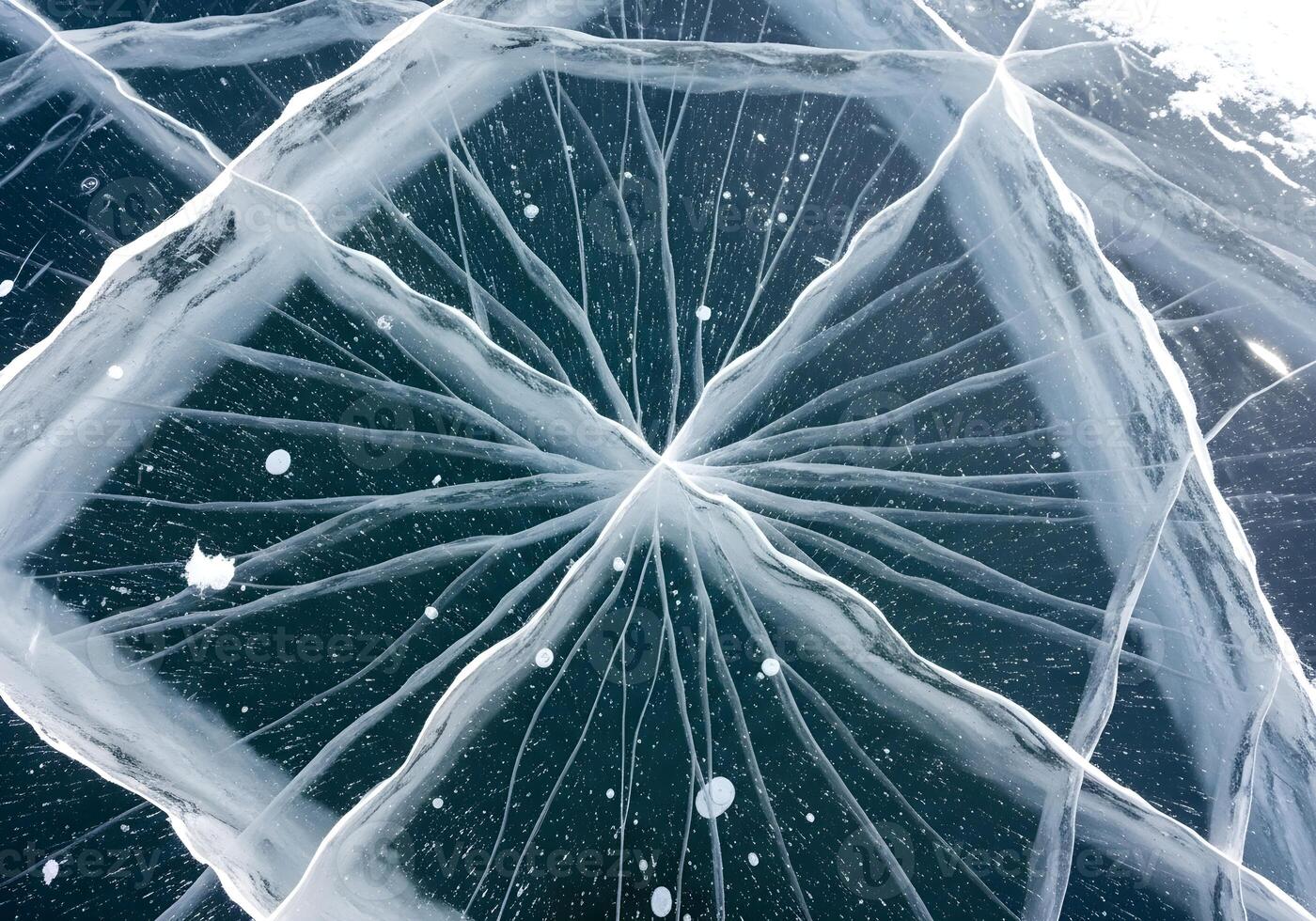 Frozen Lake Cracks Forming Spiderweb Pattern photo