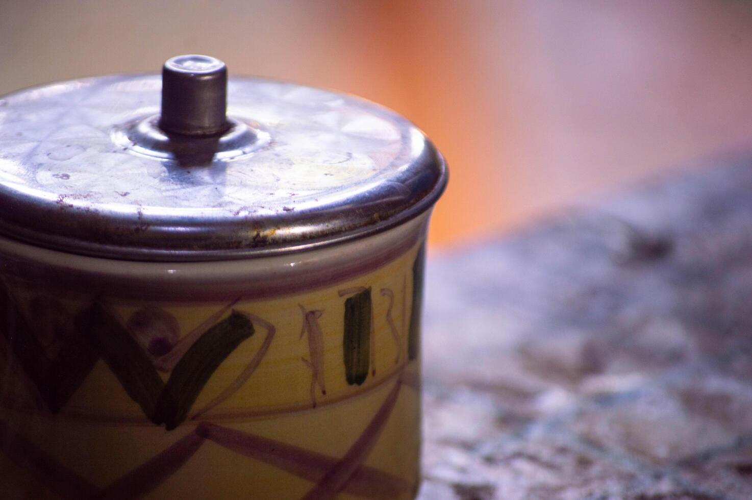 close-up of a coffee cup on a table with a blurred background photo