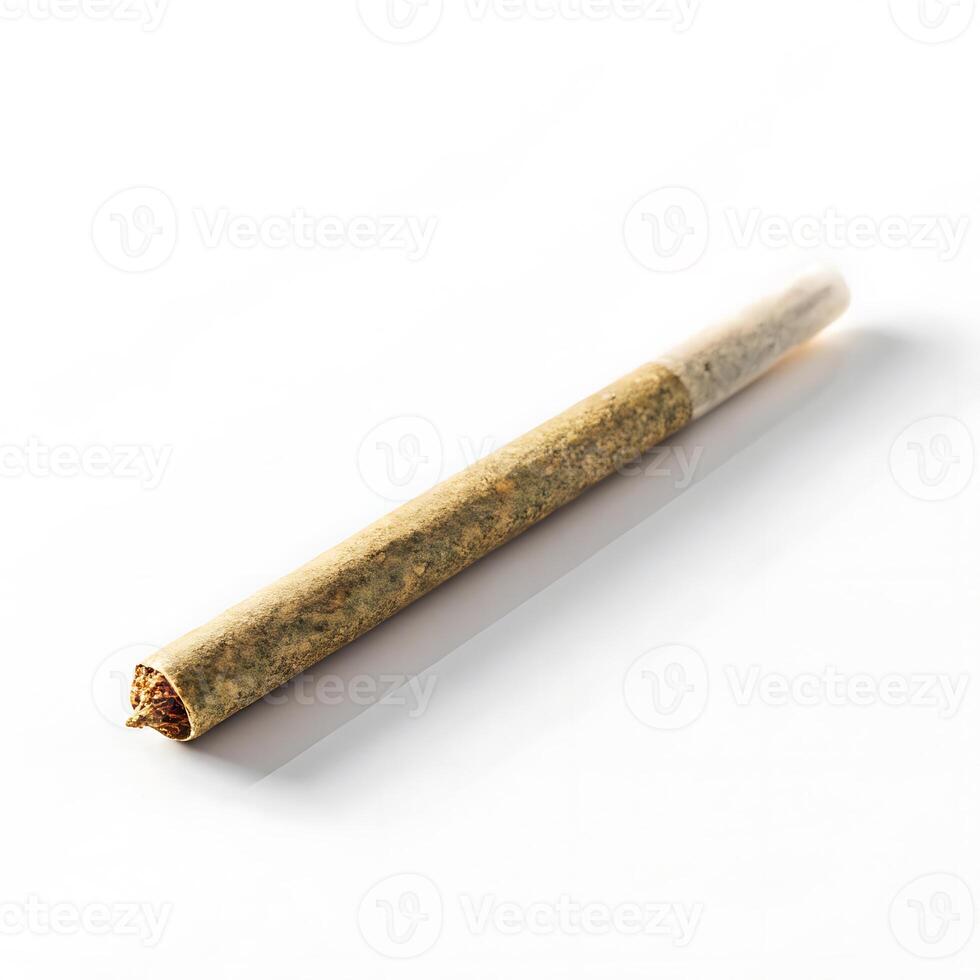 Hand rolled cannabis joint with dried marijuana on a white background photo