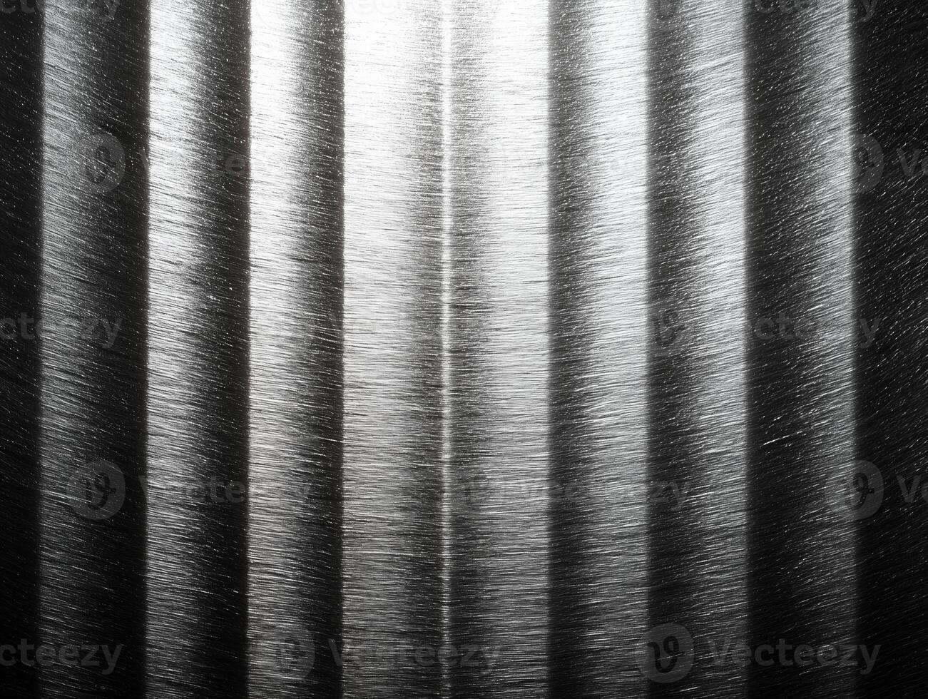 Textured silver gray metal background features vertical lines that create striking visual effect. interplay of light and shadow enhances metallic sheen, evoking sense of modernity photo