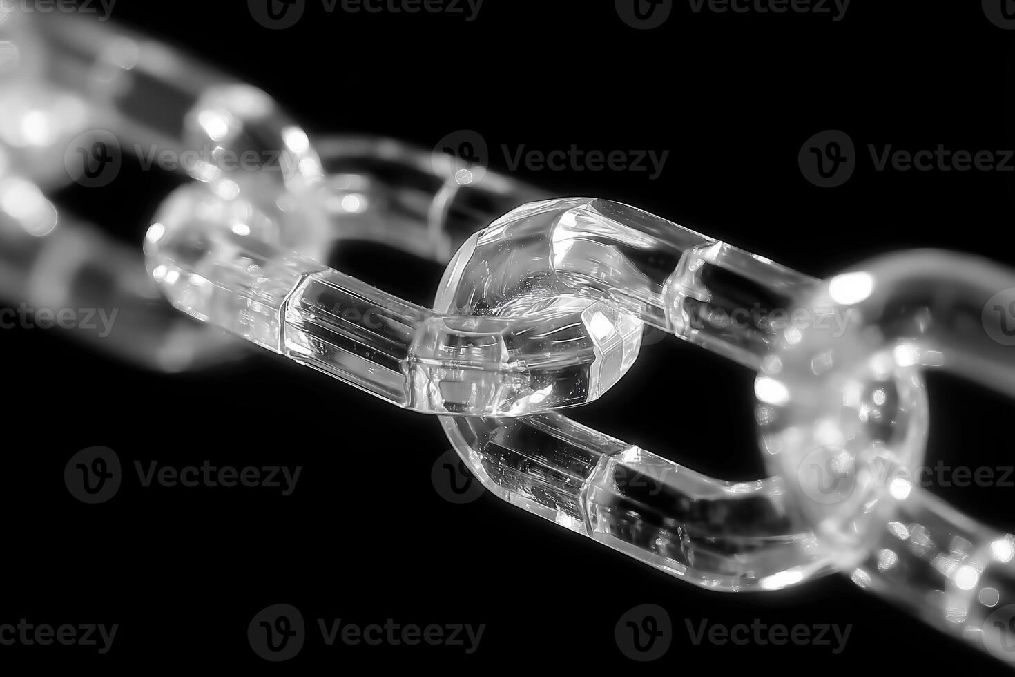 Close up of transparent chain link showcasing its clear crystal structure and intricate design, reflecting light beautifully against dark background. image evokes sense of elegance and strength photo