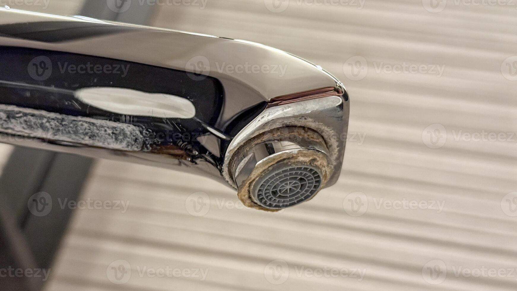 Glistening tarnished faucet, a metallic tale of neglect and limescale, echoing Water Conservation Days urgent whispers for change photo