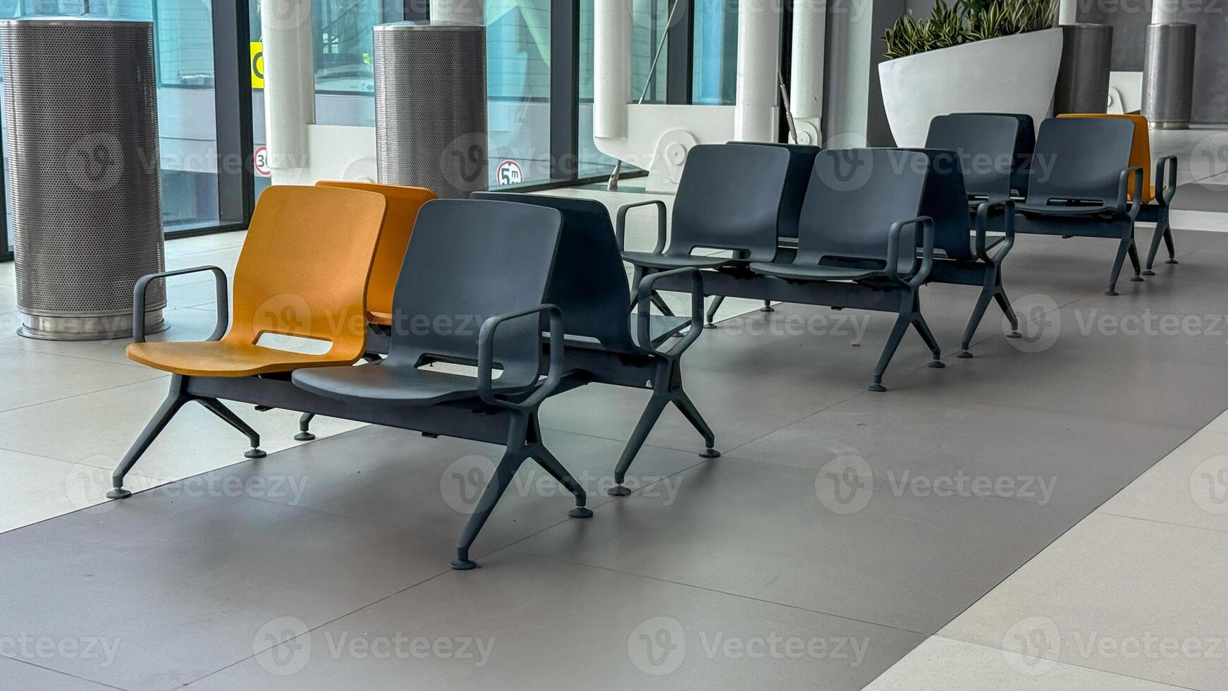 Empty chairs in a serene airport lounge, evoking solitude and anticipation, perfect for International Travel Day reflections photo