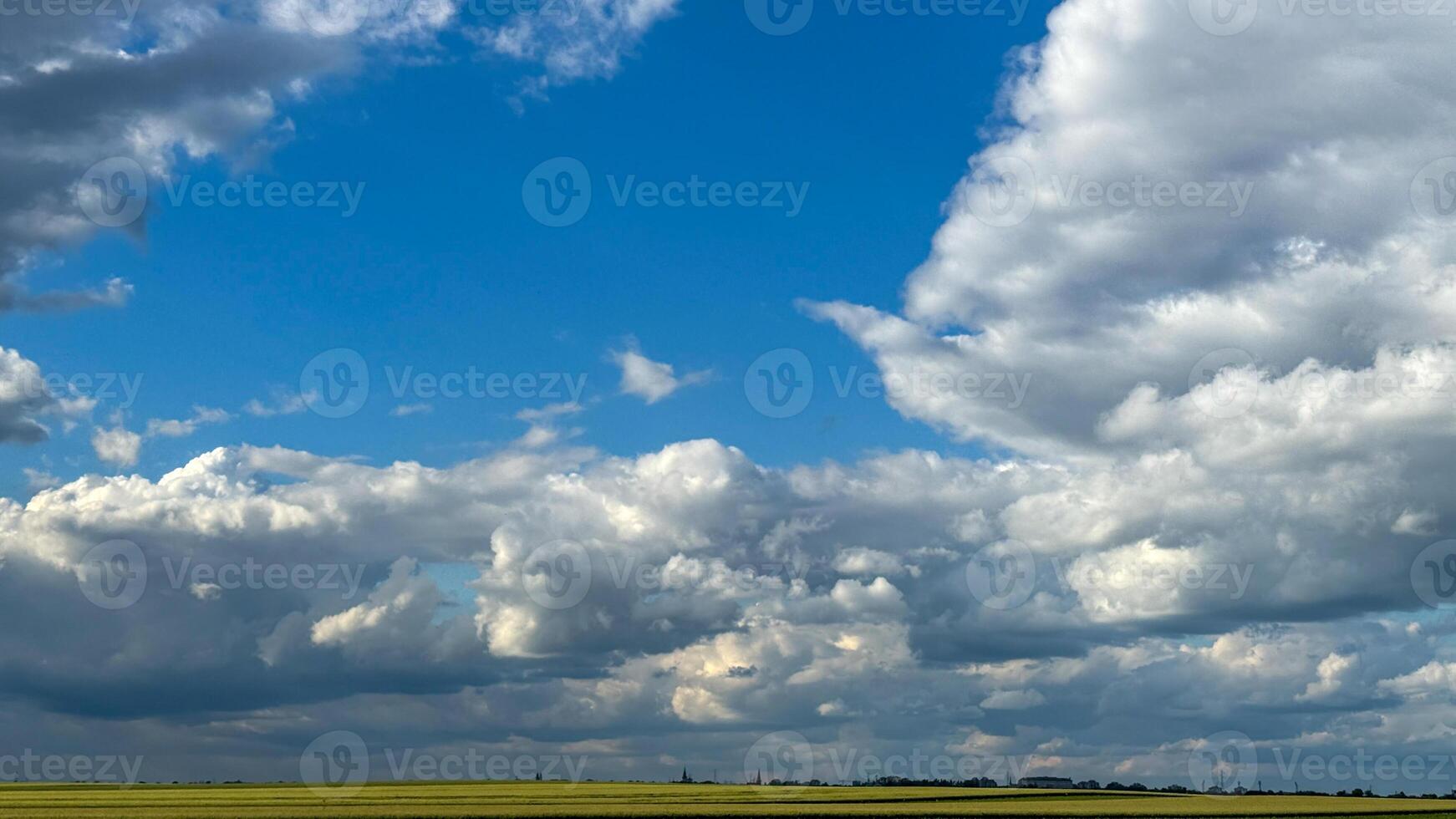 Vast azure tapestry with ethereal cloud symphony, whispers of Imbolc renewal, evoking dreams of celestial wanderlust photo