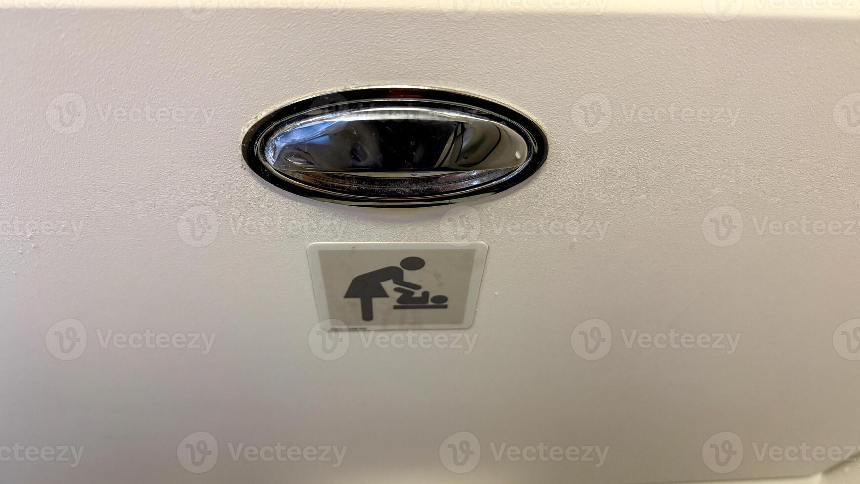 Diaper changing station icon glimmers with minimalistic charm, invoking tidy parenthood celebrates Neonatal Care Week, minimalist design aesthetic photo