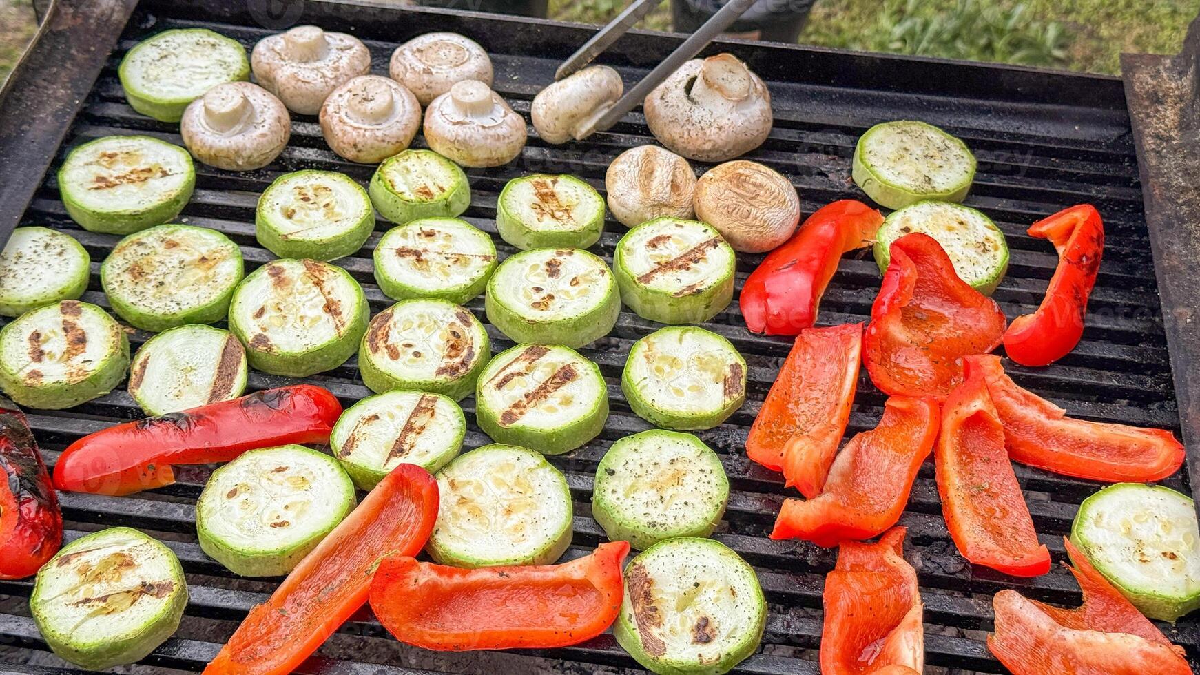 Grilled veggies sizzle under summer solstice sun, embracing Vegan BBQ Day with smoky zucchini medallions and peppery delights photo