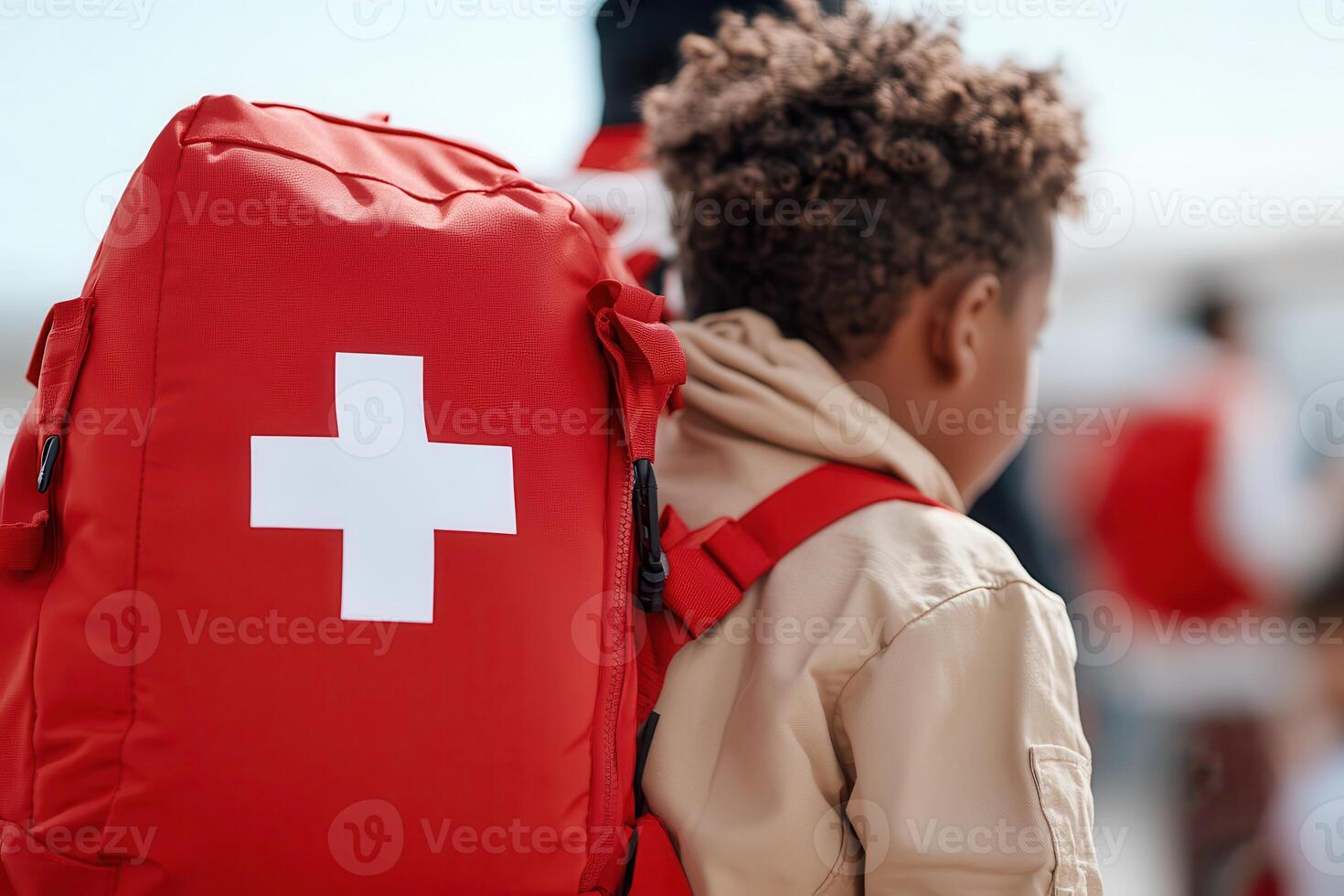 the image focuses on a red backpack with a bold white cross symbol on the front photo