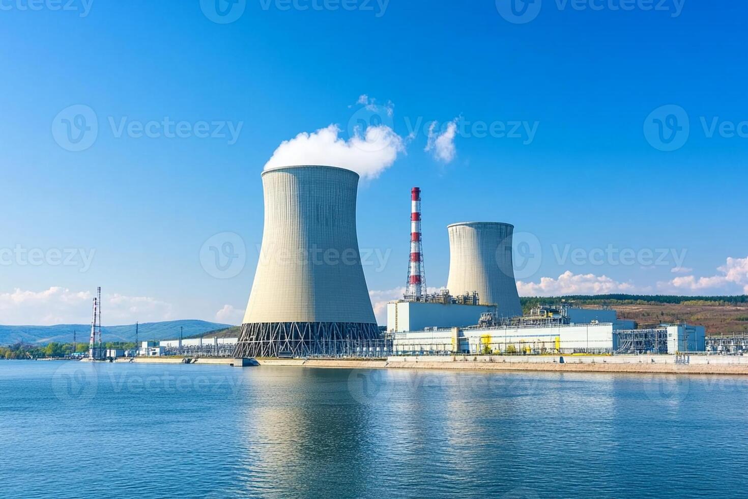 Nuclear power plant with cooling towers and water photo