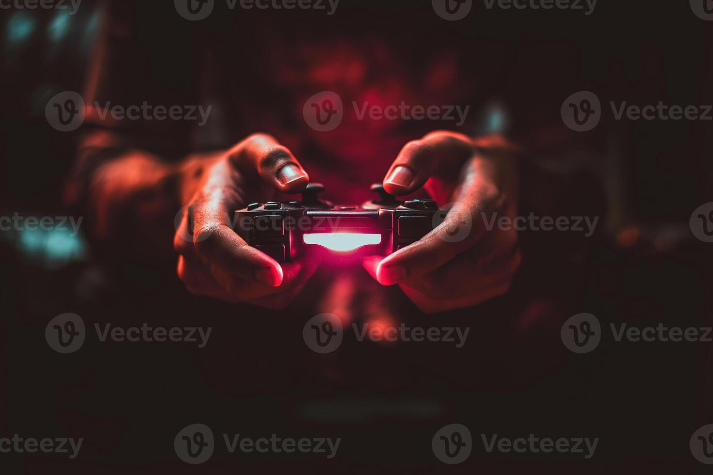 Gamer hand holding illuminated game controller in dark room, focused and intense atmosphere photo
