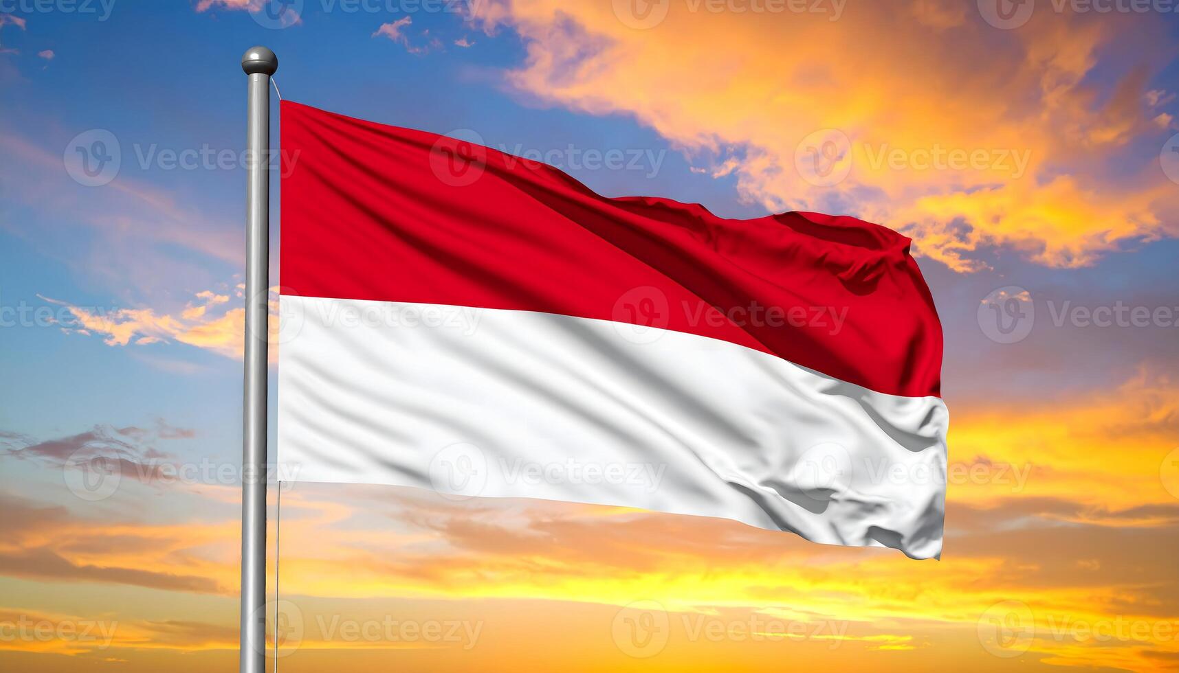 Indonesian flag, the Merah Putih, waving proudly on a flagpole against a vibrant sunset sky. A symbol of Indonesian patriotism, freedom, and national identity photo